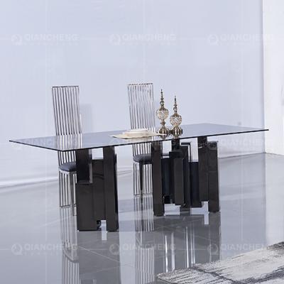 China Clear 15mm Glass Dining Table And Chairs Black Stainless Steel Base for sale