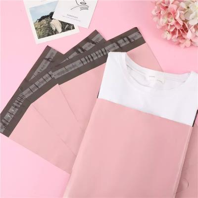 China Sacos de correspondência rosa impressos à prova d'água para embalagem de envio de correio de pano de livro à venda