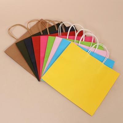 China Custom Logo Printing Reusable Kraft Paper Gift Packaging Bag With Handle for sale