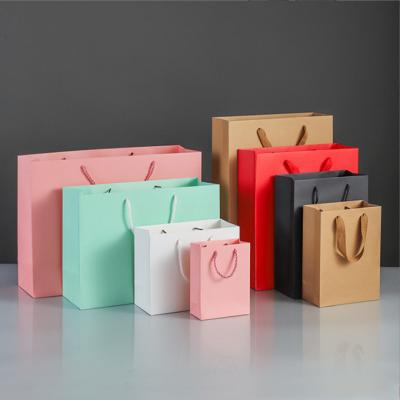 China Reusable Biodegradable Top Handle Bag Customized Kraft Paper Gift Packaging Bag for sale