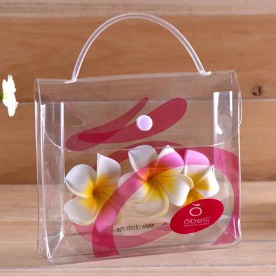 China Garment Packing Clear PVC Packaging Bags With Plastic Button and Hand for sale