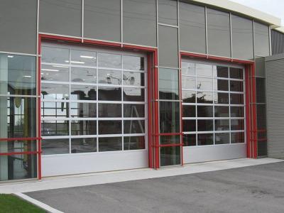 China Glass / Polycarbonate Aluminum Sectional Door Heat Resistance Smoothly With Motor for sale