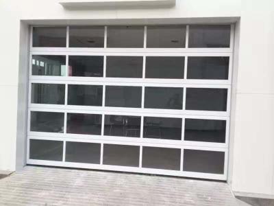 China Industrial Logistic Area Loading Port 40mm Glass Garage Aluminum Sectional Door Wind Resistance Class 3 For Fire Station for sale