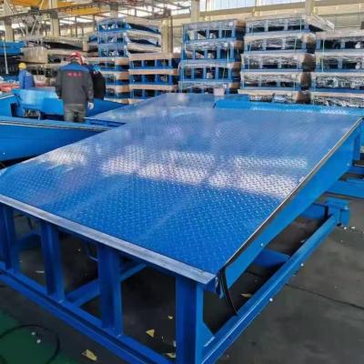 China Logistic Park High Volume Hydraulic Driving Loading Dock Leveler Heavy Duty Steel Aluminium Bumper Fixed Truck Dock for sale