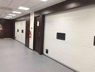 China puertas seccionales de frenado antis del garaje del rodillo del grueso de 40m m en venta