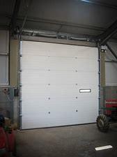 China Exterior Automatic Steel Plate Overhead Insulated Sectional Tilting Garage Door for sale