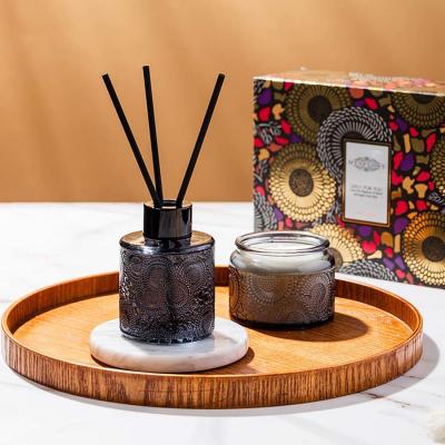 China Embossed Aromatherapy Reed Diffuser Luxury Fragrance Empty Bottle Aromatic Soybean Candle for sale