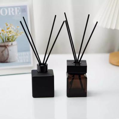 China Luxury Customised Floral Reed Diffuser Square Black Glass Bottle Perfume With Box for sale