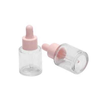 China La botella de cristal clara del Odm de la botella de cristal rosada del dropper modificó las botellas del suero para requisitos particulares en venta