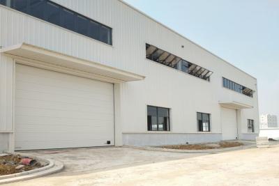 China Automatic Industrial Sectional Garage Doors With PVC Window And Sandwich Panel Steel for sale