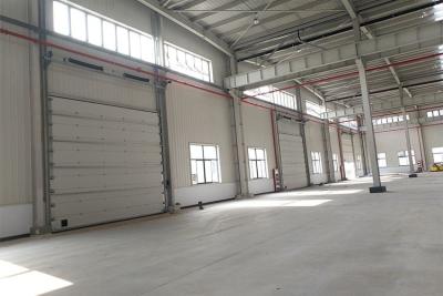 China Com segurança portas secionais da garagem, tamanho grande das portas aéreas industriais à venda