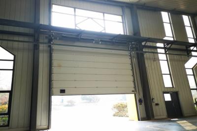 China Speed 1.0m/s Exterior Security Industrial Sectional Doors Rolling Back Model for sale
