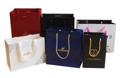 China Custom Fancy Logo Printed Shopping Paper Carrier Bags for sale