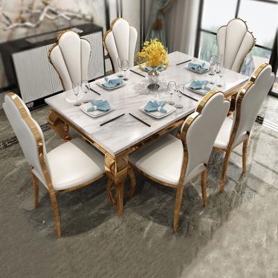 China A mesa de jantar e as cadeiras de mármore brancas ajustaram o retângulo de aço inoxidável à venda