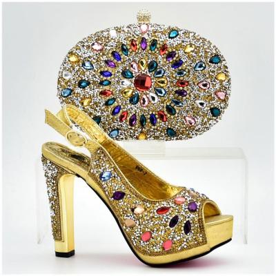 China Cheap Personalized Golden Supplier Shoe And Clutch for sale