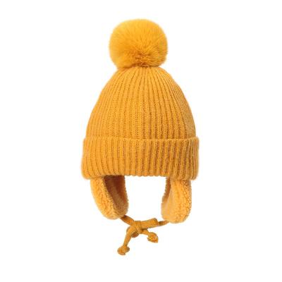 China Multiple Colors Pom Acrylic Cotton thermal beanie hats Warm With Ear Cover for sale