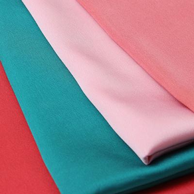 China Emerald Green 75D 130GSM Polyester Spandex Satin Fabric Stretch for sale