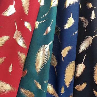 China OEM Bronzing Floral Foil Polyester Woven Fabric Leaf Printing for sale