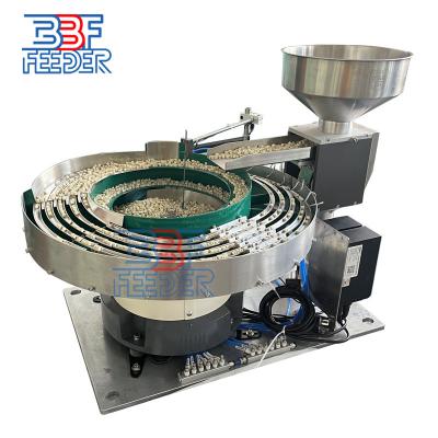 China Máquina de cuenco vibratorio multilíneo giratorio Pequeñas piezas Componentes Alimentador vibratorio en venta