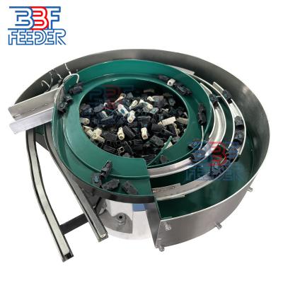 China Rotary Vibratory Bowl Feeder Plastic Parts Two Lanes Vibrating Feeding Machine for sale
