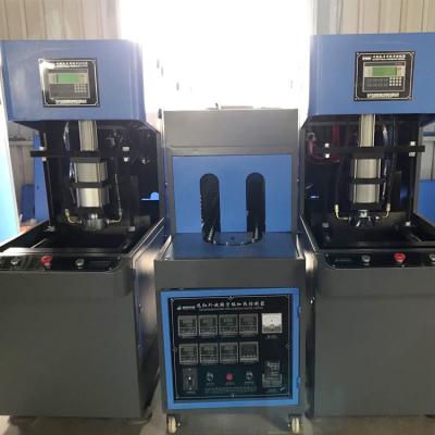 China Máquina de sopro de garrafas semiautomáticas PET 100 KN e peças sobressalentes com elevada força de fixação à venda