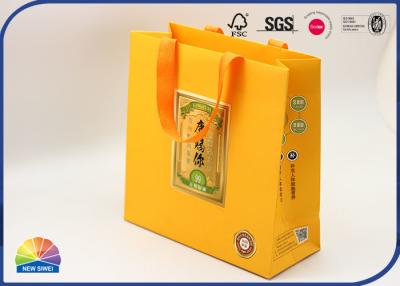 China Eco Friendly 250gsm Coated Paper Gift Shopping Bags Orange Color Matt Lamination for sale