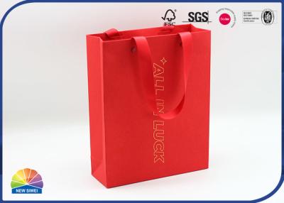 China Gold Stamping Logo Paper Gift Bag Bright Red Color For Holiday Gifts Packaging for sale