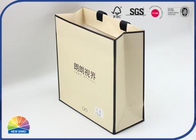 China Brown Folding Paper Shopping Bags Matte Lamination With Ribbon Handle à venda