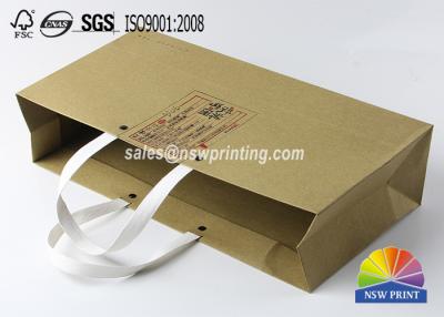 China Kraft Custom Paper Shopping Bags , Plastic Handle Eyelet Brown Craft Tea Gift Bags for sale