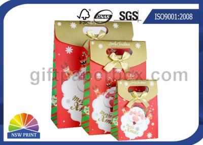China Customized Christmas Gift Packaging Bag with Die Cut Handles Ribbon Bowknot for sale