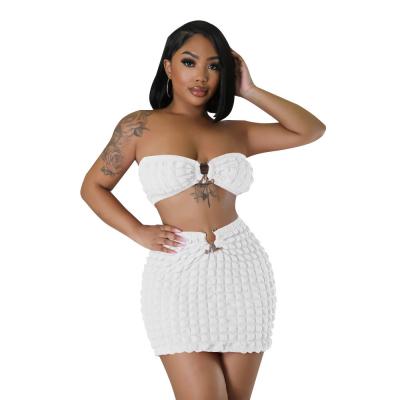 China Cheaper Wholesale Solid Color Bra Top Short Skirt Bubble Sexy Women Two Piece Set for sale