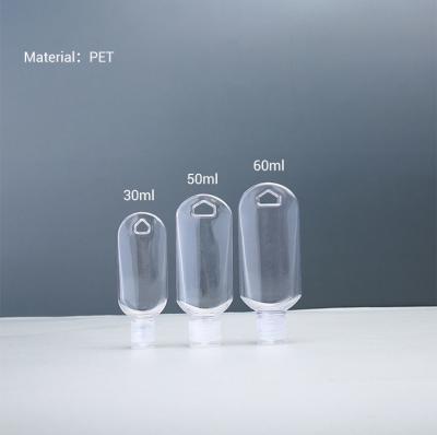 China Refillable Clear 50ML PETG Heart Shaped Travel Bottle With Hook Alcohol Spray Cap for sale