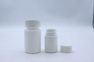 China 70ml PE Plastic Empty White Capsule Bottle With Child Resistant Cap for sale