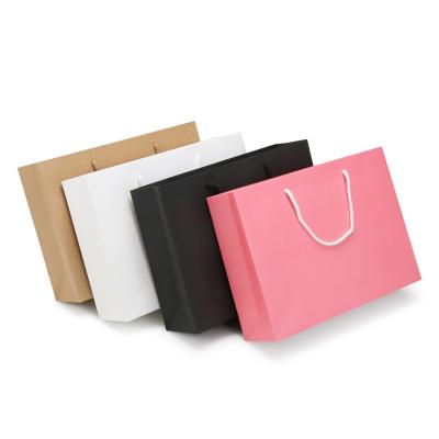 China Shopping Colored Fancy Paper 100g Garment Packaging Bags Flexo Printing for sale