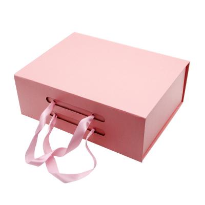 China Luxury Customized Gift Foldable box Ribbon paper hard cardboard gift boxes Flip Top String Ribbon Handle Flat Paper Box for sale