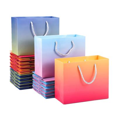 China Hologram Effect Printed Paper Carrier Bags With Ribbon Handle Pantone for sale