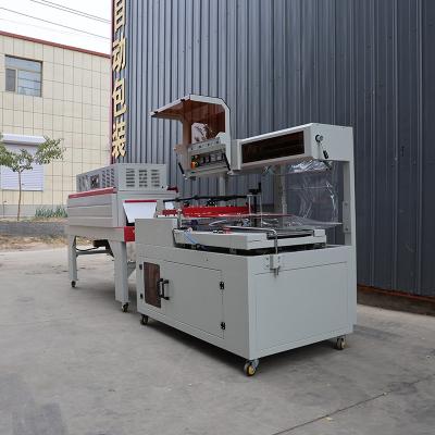 China Fully Automatic L sealing Box Shrink Wrap Machine 1.35KW Shrink Packaging Machine for sale
