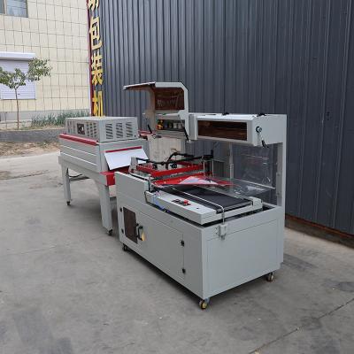 China 1.35KW L sellador máquina de envoltura de encogimiento totalmente automática para alimentos y bebidas en venta