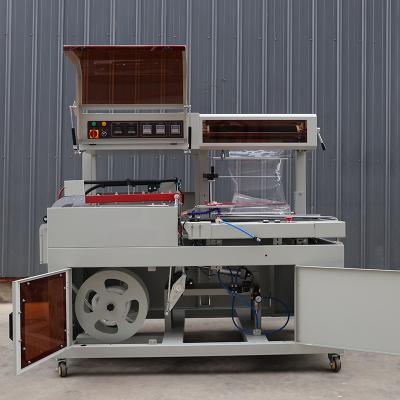 China 1.35KW L Sealing Fully Automatic Shrink Wrapping Machine For Food Packaging 50 / 60HZ for sale