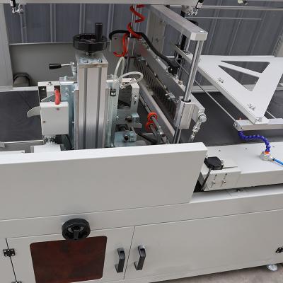 China Máquina de embalaje de película de acero inoxidable para bebidas totalmente automática en venta