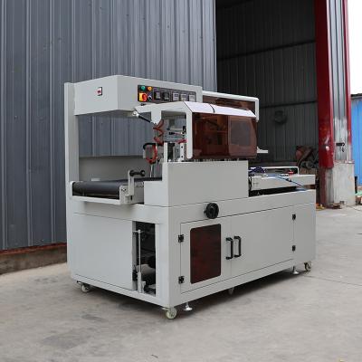 China POF / PE Film Box Shrink Wrap Machine Pneumatic Heat Film Shrink Wrap Equipment for sale
