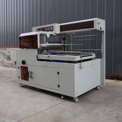 China Stainless Steel Box Shrink Wrap Machine Pneumatic Driver All In One Packaging System for sale