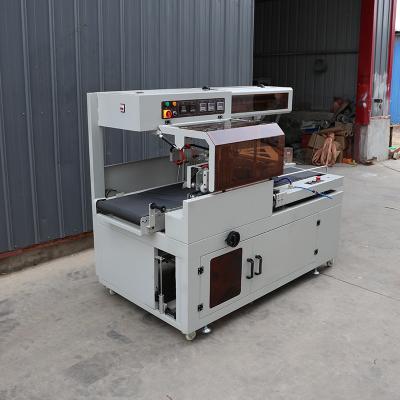 China Pneumatic Driver Edge Sealing Packaging Machine Automatic Heat Shrink Wrap Machine for sale