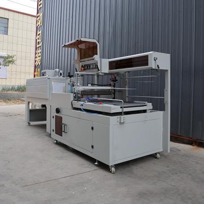 China Pneumatic Heat Shrink Film Packaging Machine PLC Control High Speed Shrink Wrapper for sale