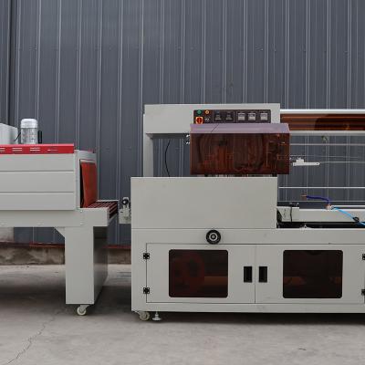 China Multifunctional Plastic Wrap Packaging Machine PLC Control Shrink Wrap Machine for sale