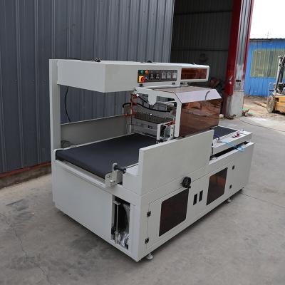 China Máquina de embalaje de sellado de acero inoxidable Máquina automática de embalaje de película de contracción térmica en venta