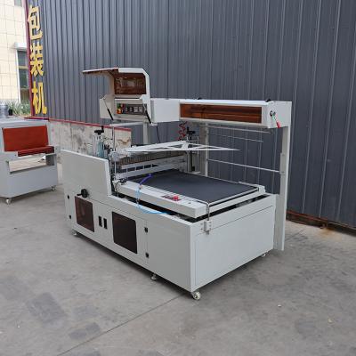 China Pneumatic Plastic Film Sealing Packaging Machine PLC Control Thermal Shrink Packing Machine for sale