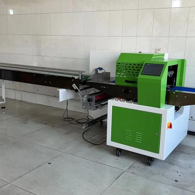 China Electric PLC Control Multi Function Packaging Machine Pillow Bag Wrapper Sealing Machine for sale