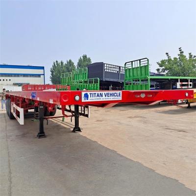 China TITAN 40 ft tri axle flat deck top semi trailer for sale in Zambia à venda