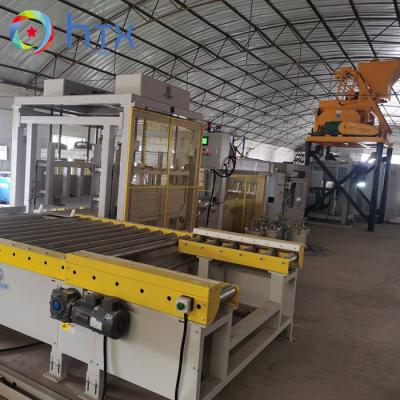 China Automatic PLC Control System Veneer Stone Production Line Concrete Retaining Block Filling Machine zu verkaufen